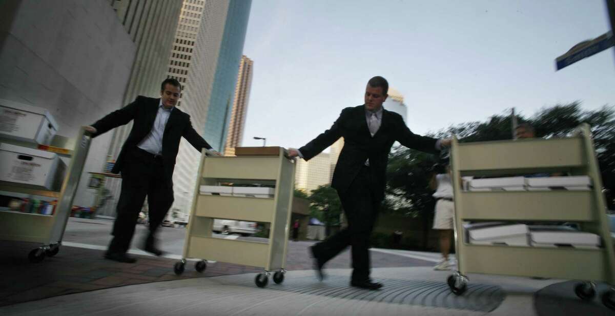 5/3/2006--Legal assistants with boxes of trial documents arrive for the start of court, Wednesday, the 51th day and in the fourteenth week of the fraud and conspiracy trial of former Enron Chairman Ken Lay and former Enron CEO Jeff Skilling at the Bob Casey United States Court House in Houston. Photo by Steve Ueckert / Houston Chronicle