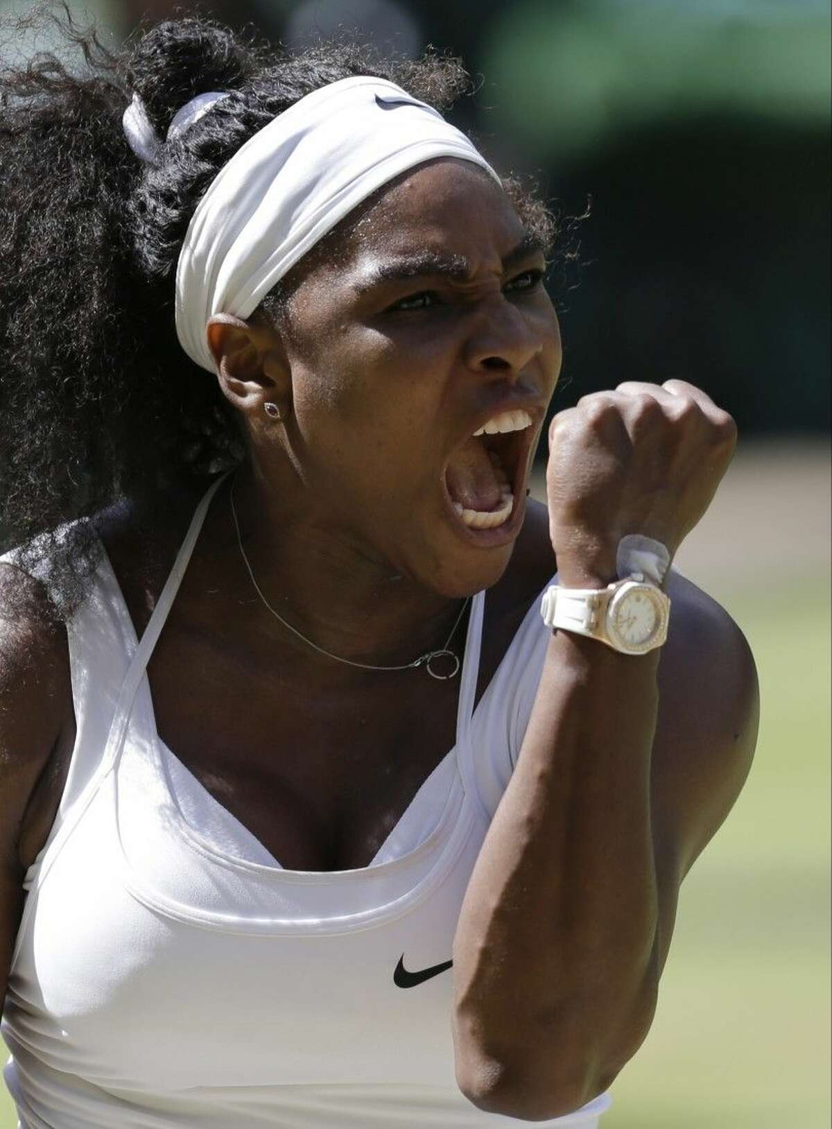 Serena Williams of the United States celebrates winning a point against Garbine Muguruza of Spain during the women's singles final at the All England Lawn Tennis Championships in Wimbledon, London, Saturday.