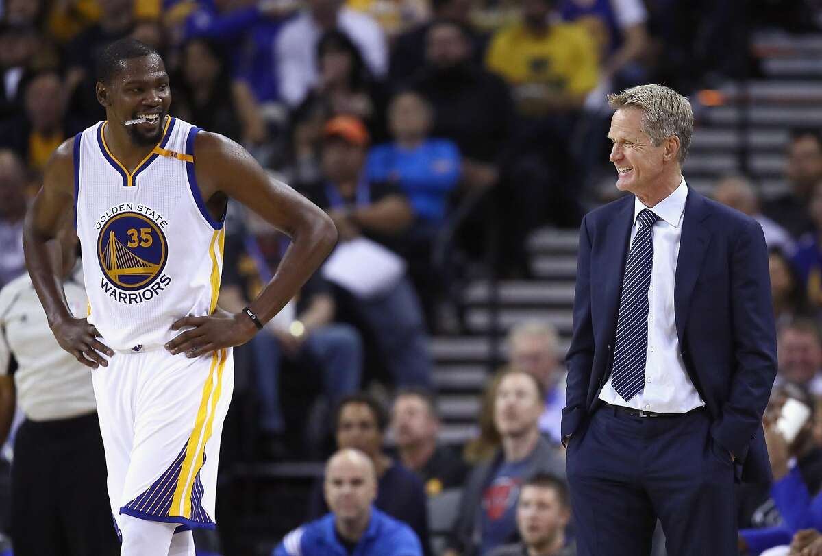 OAKLAND, CA - OCTOBER 04: Head coach Steve Kerr of the Golden State Warriors talks to Kevin Durant #35 during their preseason game against the Los Angeles Clippers at ORACLE Arena on October 4, 2016 in Oakland, California. NOTE TO USER: User expressly acknowledges and agrees that, by downloading and or using this photograph, User is consenting to the terms and conditions of the Getty Images License Agreement. (Photo by Ezra Shaw/Getty Images)