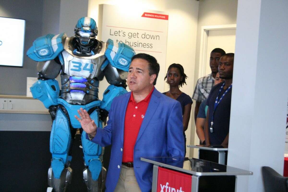 Ralph Martinez, senior vice president of Comcast’s Houston Region, speaks about the advances they are making for customers at the grand opening of the XFINITY store in Humble Saturday, Aug. 8, 2015.