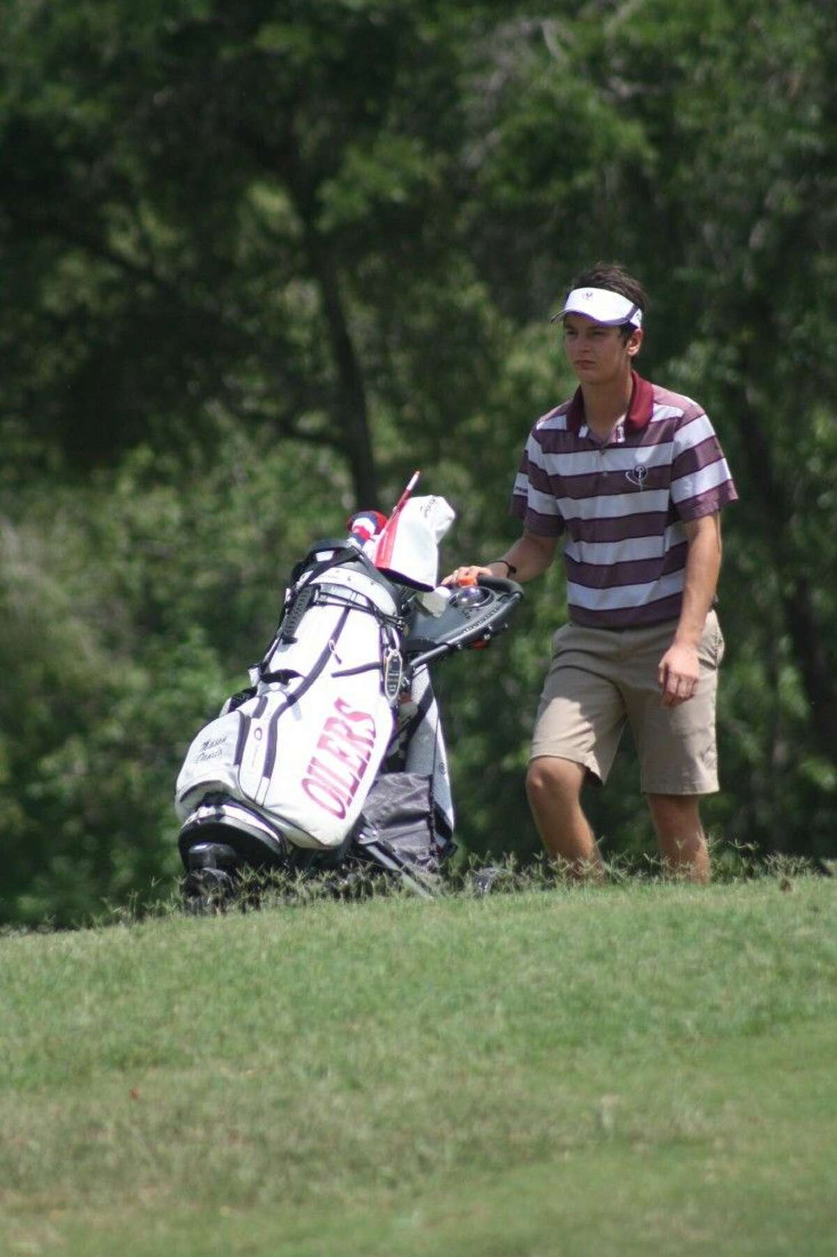 Pearland's Mason Dando ponders his next shot at the Region III-6A golf tournament in Mont Belvieu last Thursday.