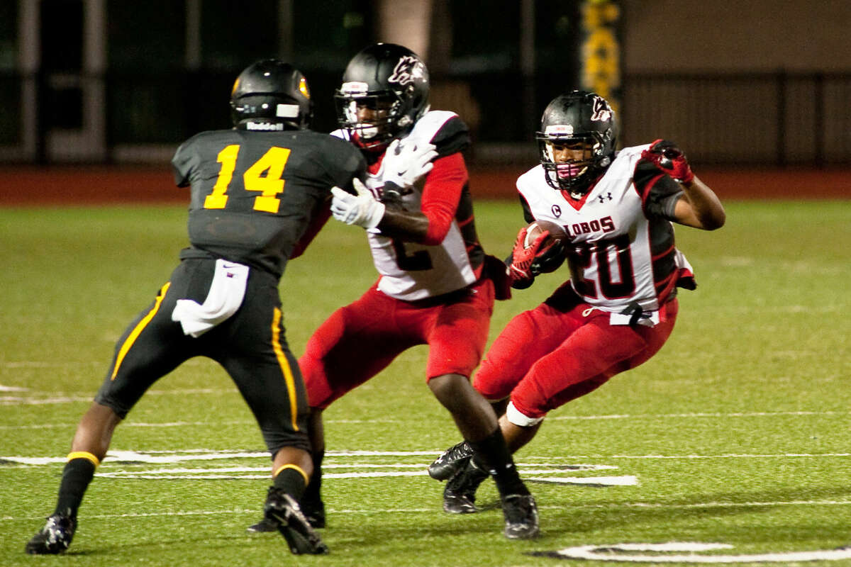 Tailback Christopher Williams (20) and receiver Quartney Davis (2) hope to help Langham Creek score a win over rival Cy Falls on Thursday.