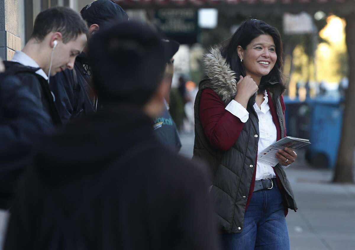Marjan Philhour, running for Supervisor in District 1, meets and greets voters waiting at the bus stop at Geary Boulevard and 25th Avenue in San Francisco, Calif. on Wednesday, Oct. 5, 2016.