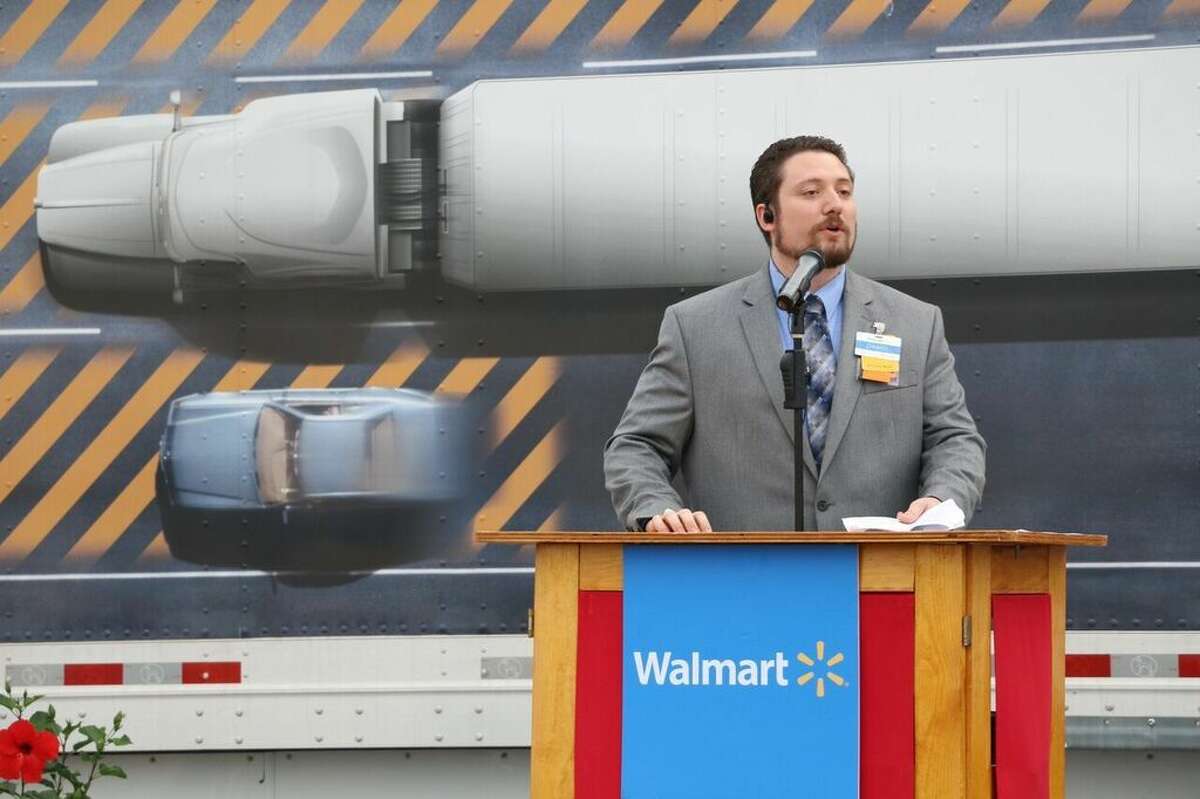 Wal-Mart store manager Daniel Parks gives a speech at the grand opening of the new location off Riley Fuzzel Road.