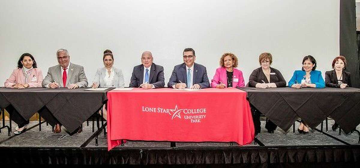 Representatives from various colleges, universities and civic organizations committed to supporting the work of the Texas Center for Hispanic Achievement during the Latino Education Summit III conference at Lone Star College-University Park on May 3. Pictured, from left, are Carolina Paz-Giraldo, Klein ISD; Richard R. Farias, American Latino Center for Research, Education & Justice; Melissa Gonzalez, Houston Community college; Lone Star College Chancellor Stephen C. Head; Lone Star College-University Park President Shah Ardalan; Maria Bhattacharjee, University of Houston-Downtown; Melinda Kirtley, Our Lady of the Lake University; Gracie Guerrero, Houston ISD; and Carolyn Martinez, Sam Houston State University. Signers who are not in this photo include Carolina Avendano, Rice University; and Javier S. Perez, Talento Bilingue de Houston.