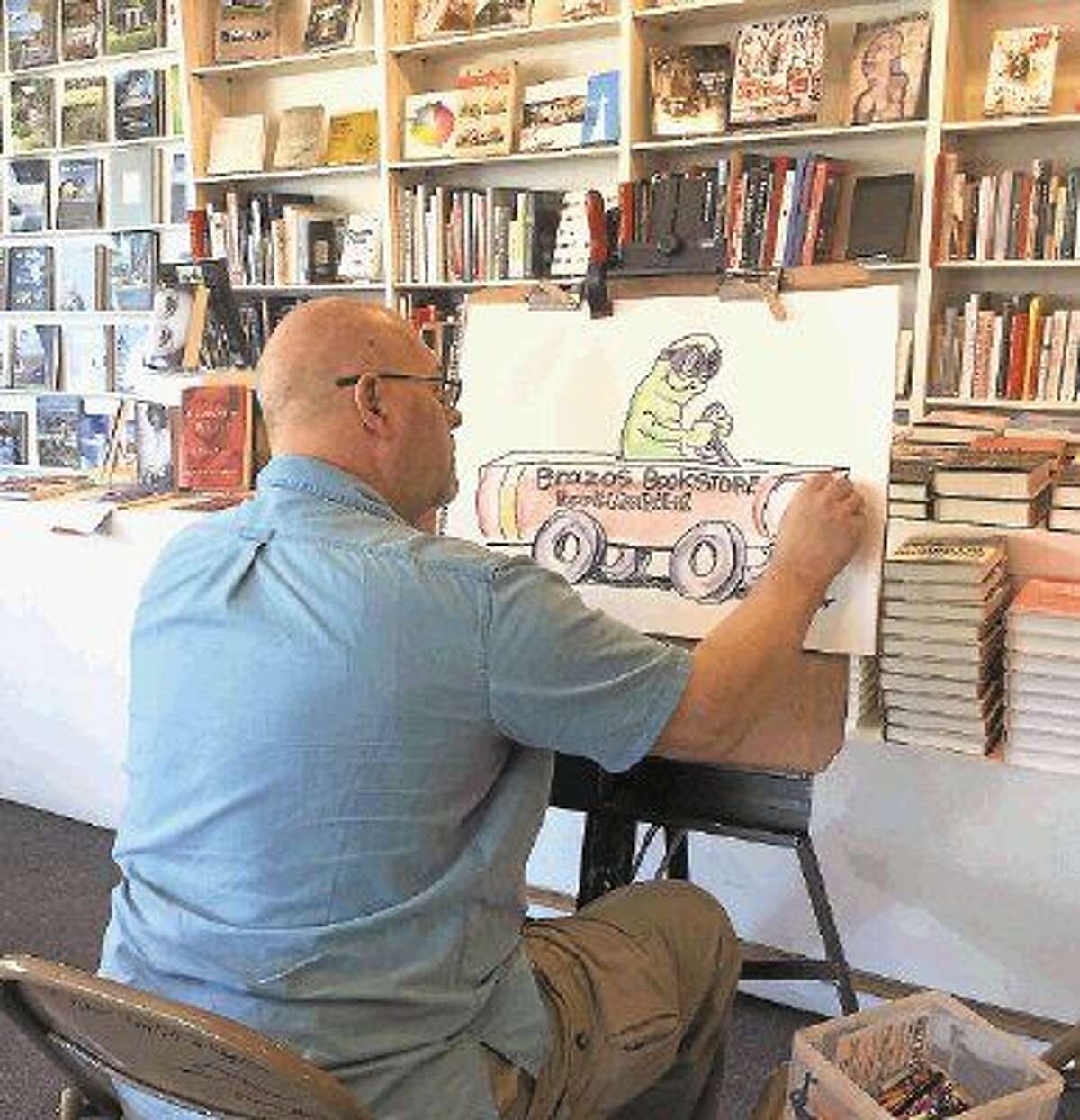 On March 26, Bill Megenhardt drew artwork for children at the Brazos Bookstore story time.