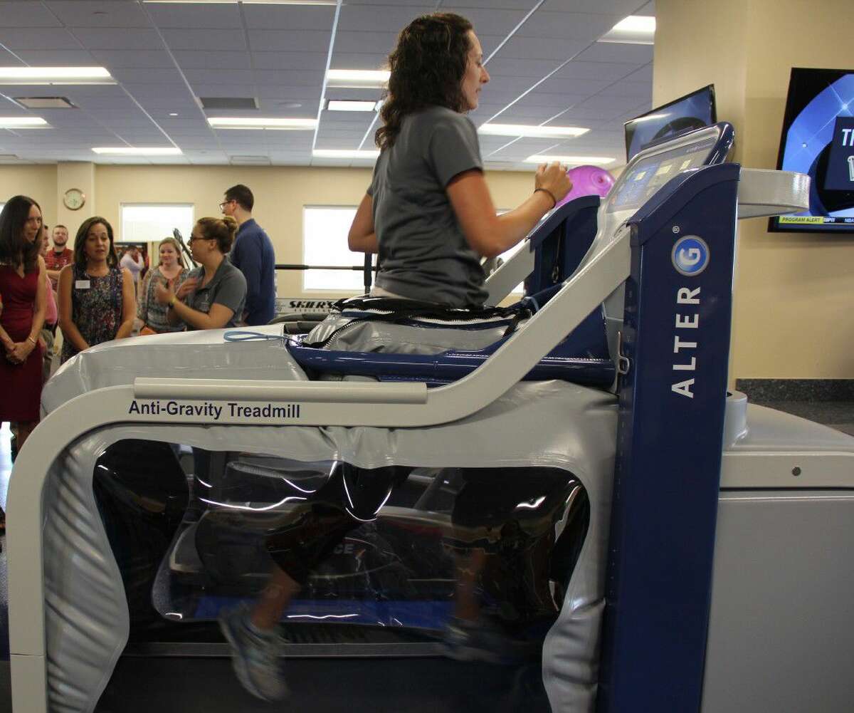 Charene Welsh-Mattson, physical therapist at the North Cypress Medicine & Rehab Center, demonstrates how the Anti-Gravity Treadmill works on Tuesday, May 10.