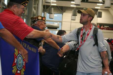 Community members and members of a local VFW had the chance to welcome Wounded Warriors at IAH Thursday, May 19, 2016, as they head out for Wounded Warriors weekend which includes deep-sea fishing trip in Port O’Connor