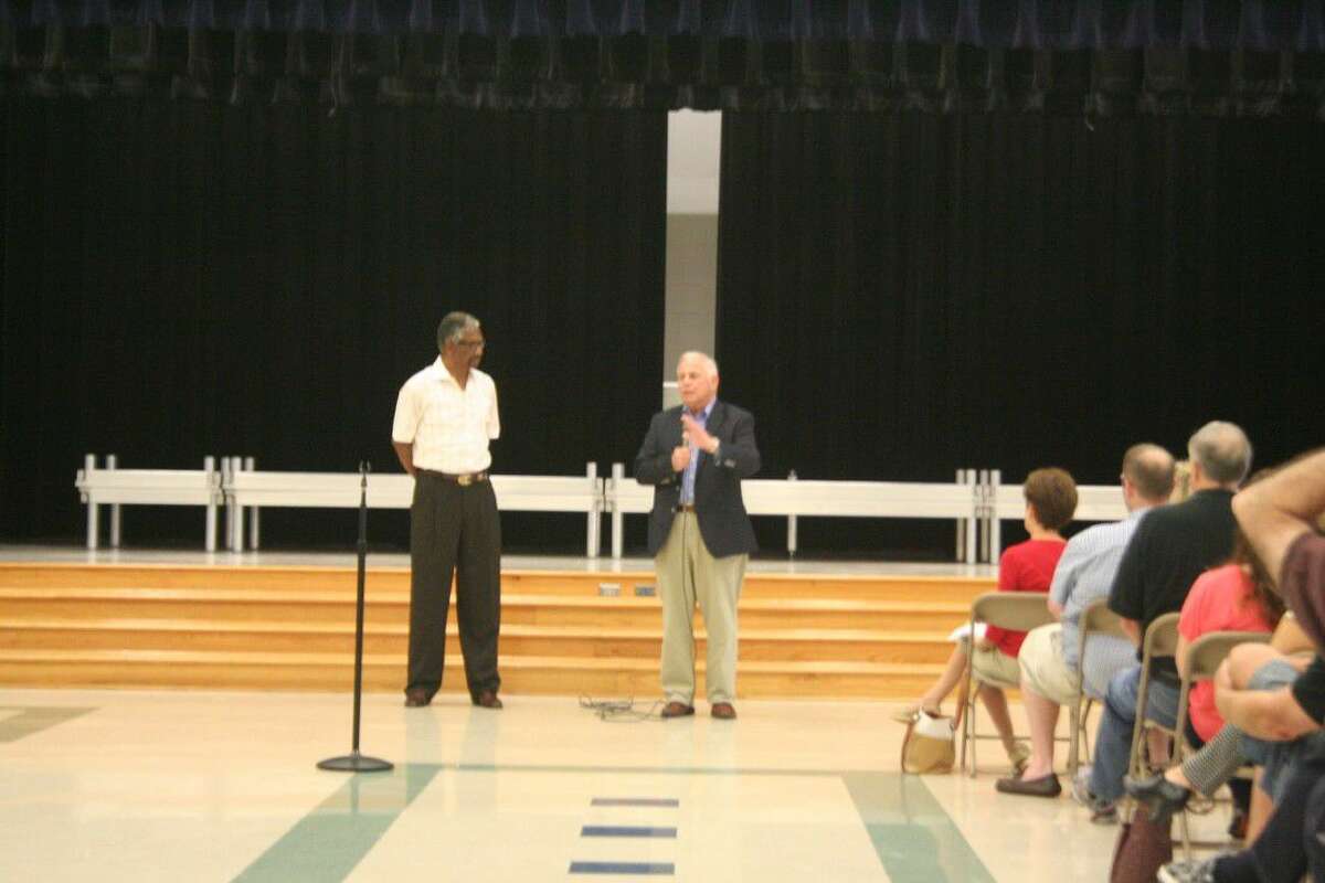 State Representative Harold Dutton, left, and U.S. Representative District 29 Gene Green speak with residents at a Town Hall meeting held in Fall Creek Saturday, April 30, 2016.