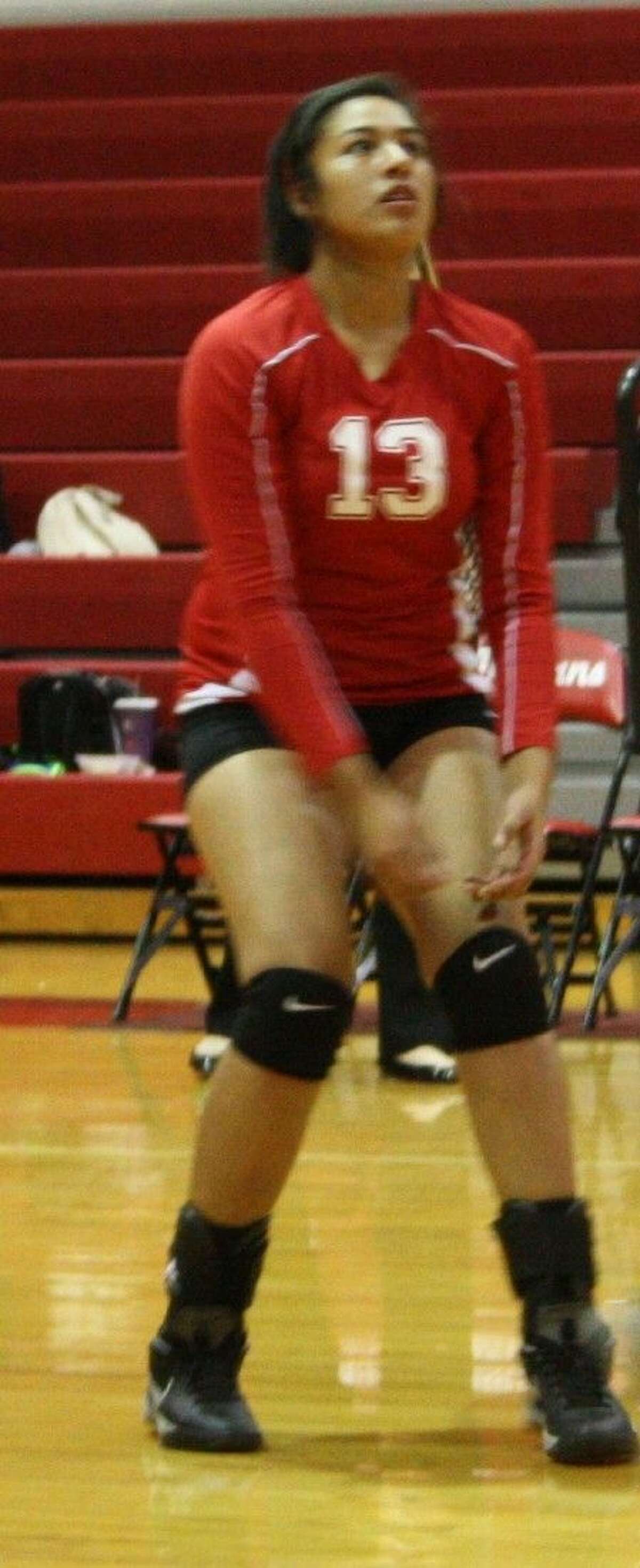 Olivia Rivera of the Lady Indians prepares to repel the ball to the Lady Falcons.