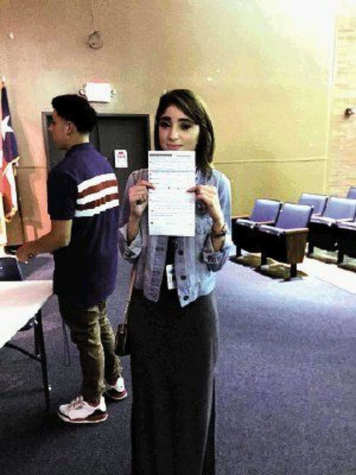 Zahely Estrada, 18, a senior at Aldine High School, prepares to register to vote.