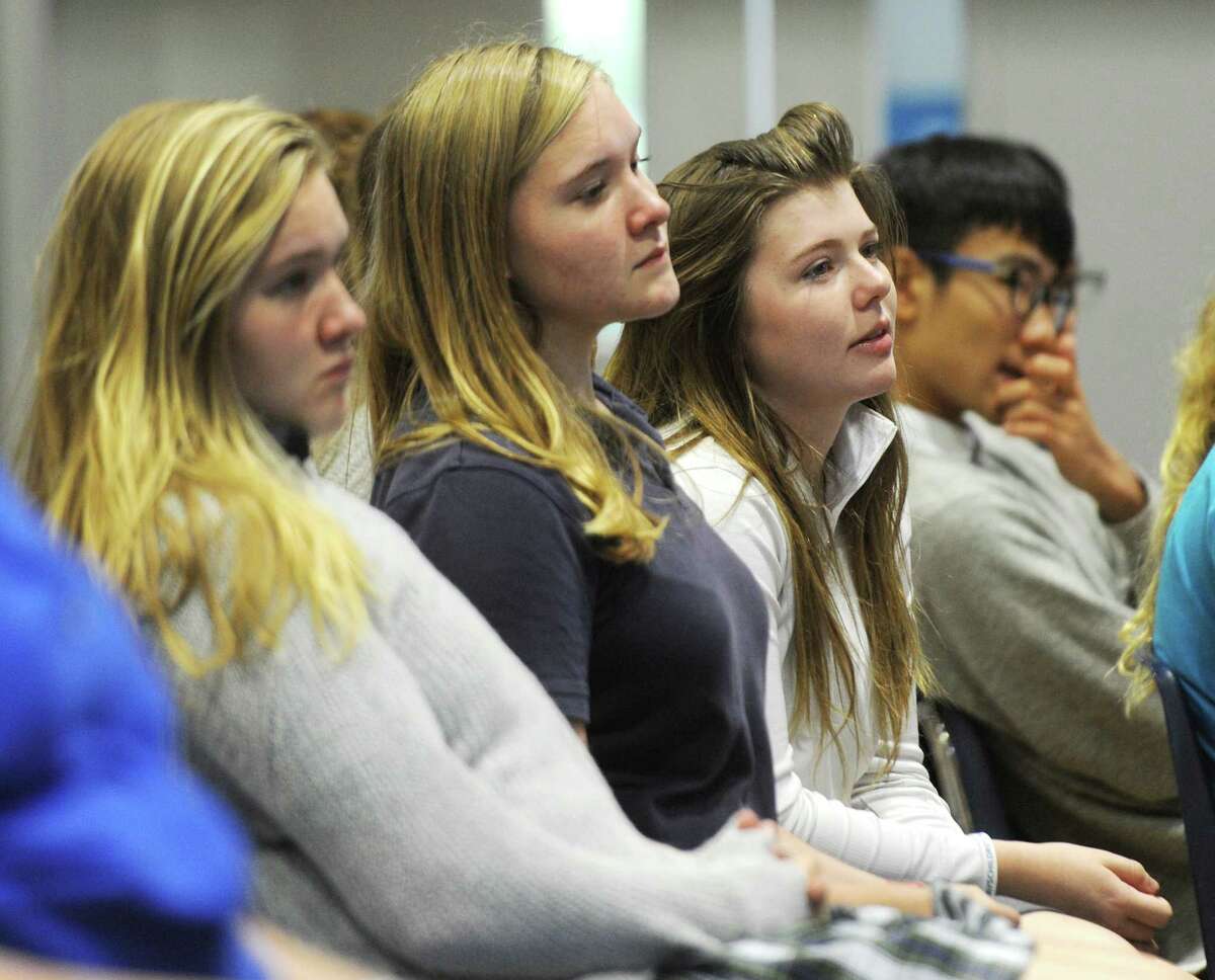 Stanwich sophomores Emily Catterson, left, Alex Catterson, center, and Kayla Foster listen as Republican Town Committee Chair Stephen Walko speaks at Stanwich School in Greenwich, Conn. Tuesday, Oct. 4, 2016. Walko spoke about his stance on certain issues and the political process before fielding questions from Senior House students.