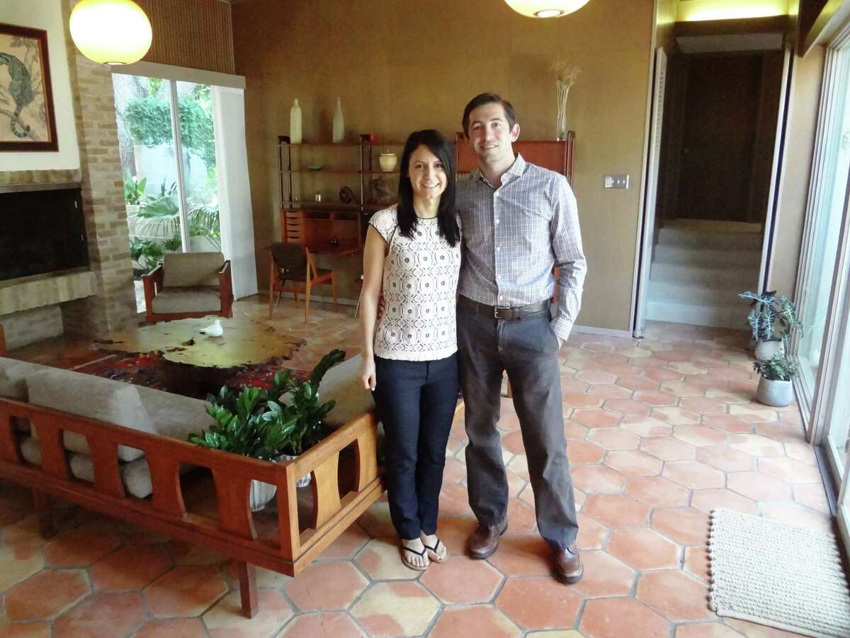 Sahar and David Weil in the living room of their O'Neil Ford home.