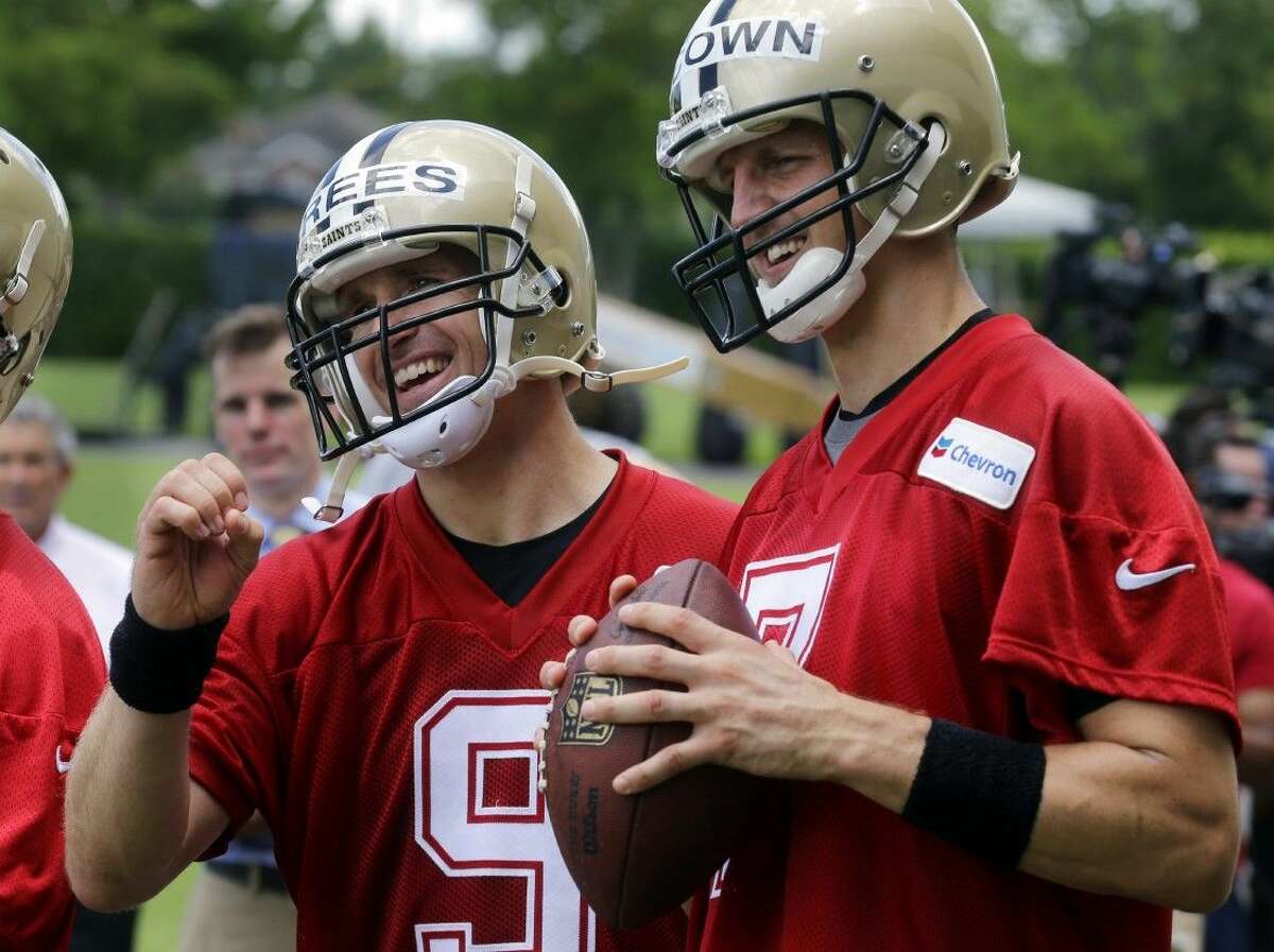 New Orleans Saints quarterback Drew Brees, left, will be sidelined for New Orleans’ game at Carolina on Sunday.