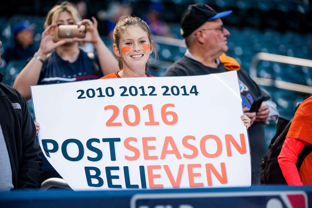 San Fransciso Giant fans hold up signs before the NL Wild Card Playoff game between the New York Mets and San Francisco Giants on Wednesday, October 5th, 2016.
