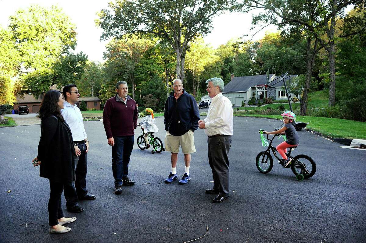 Residents of Deer Trail Drive in Brookfield meet with the town's First Selectman Steve Dunn to talk about the access road Eversource is proposing at the end of their cul-de-sac. From left are Ling-Ling and Alan Olague, Rich Stabile, Charles Tupper and Dunn. Residents believe it will be a major disruption to their community. Photo Wednesday, Oct. 5, 2016.
