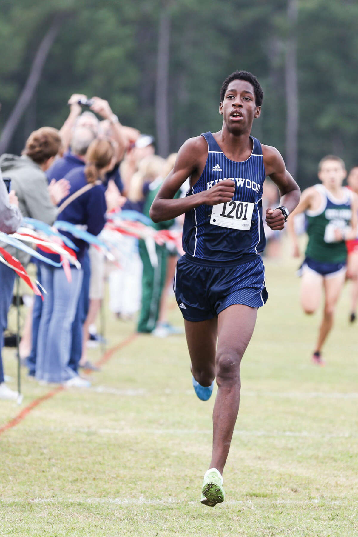 Kingwood's Charles Mills competes in the 16-6A District Cross Country Meet on Thursday, Oct. 23, 2014, at Atascocita High School.