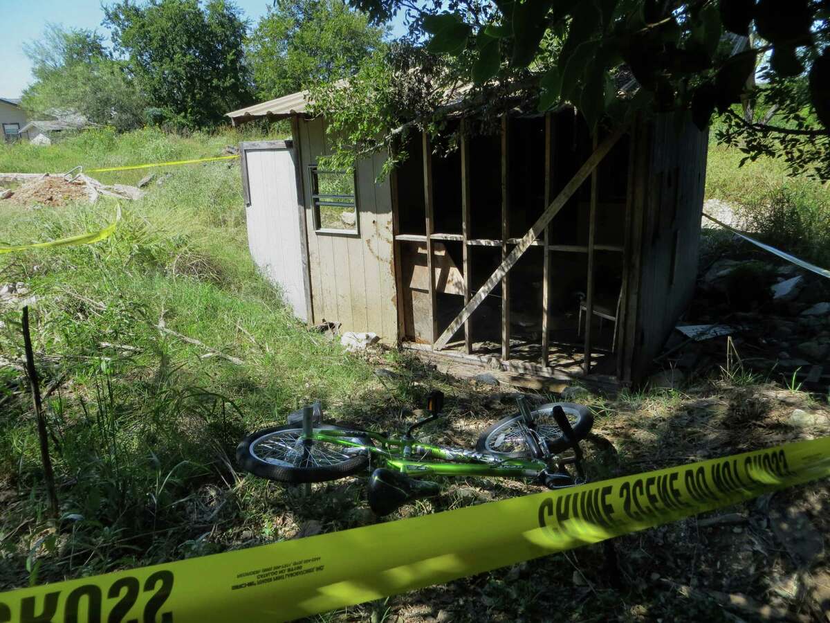 Kayden Culp‘s bicycle lies next to the shed where he was burned while playing with other children Sunday in Kerrville. Kayden, 10, was at a University Hospital after suffering second degree burns over 20 percent of his body. Authorities are investigating the incident.