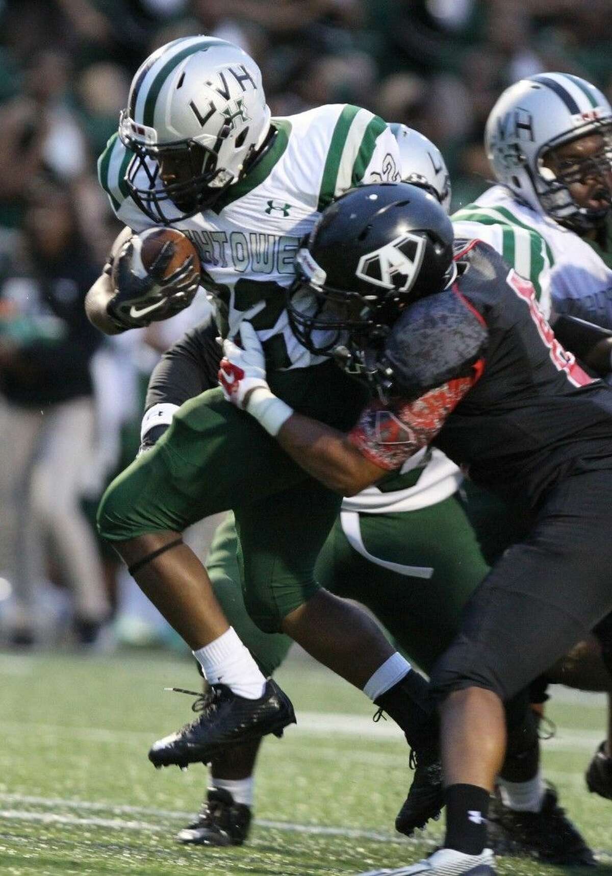 Hightower's LaGeorge Allen runs against Austin's Zach Davis, Sept. 12 at Mercer Stadium in Sugar Land. To view or purchase this photo and others like it, go to HCNPics.com.