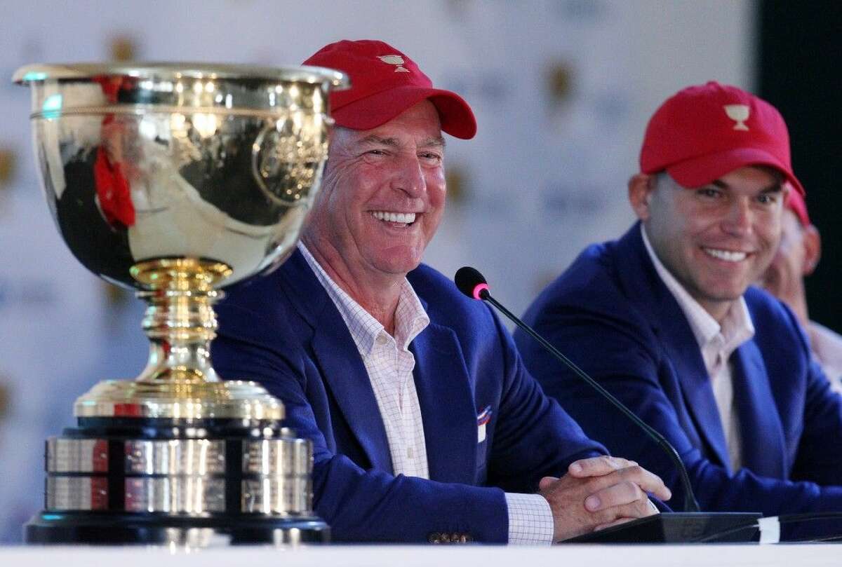 United States team captain Jay Haas, left, and his son Bill Haas smile after the Americans retained the Presidents Cup on Sunday in South Korea.