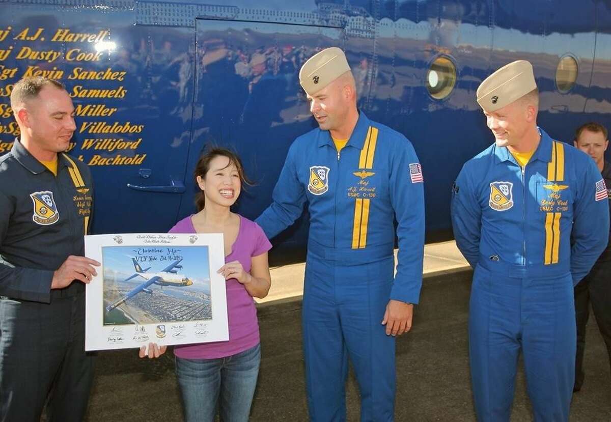Christine Ha receives an autographed photo from the crew of "Fat Albert."