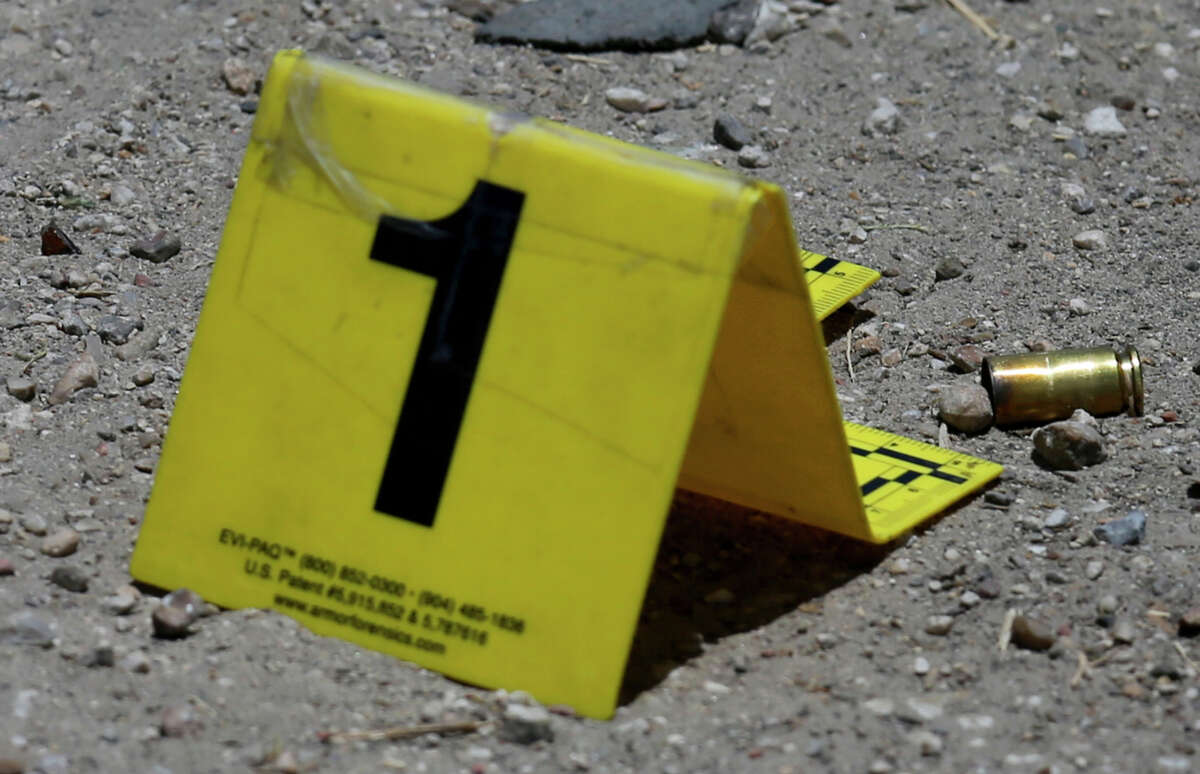 Markers indicate where bullet shell casings landed Thursday June 23, 2016 on the 2100 block of Burnet where two people were shot near the Walters Food Mart. Police received reports of the shooting around 12:45 p.m. at the intersection of North Walters and Burnet Streets and arrived at the parking lot of the Walter's Food Mart within seconds, according San Antonio Police Department Chief William McManus. At this point the victims are not cooperating with police. One of the victims was taken to the San Antonio Medical Center and the other was taken to University Hospital for treatment. Officers said one of them was shot in the hip and the other in the leg.