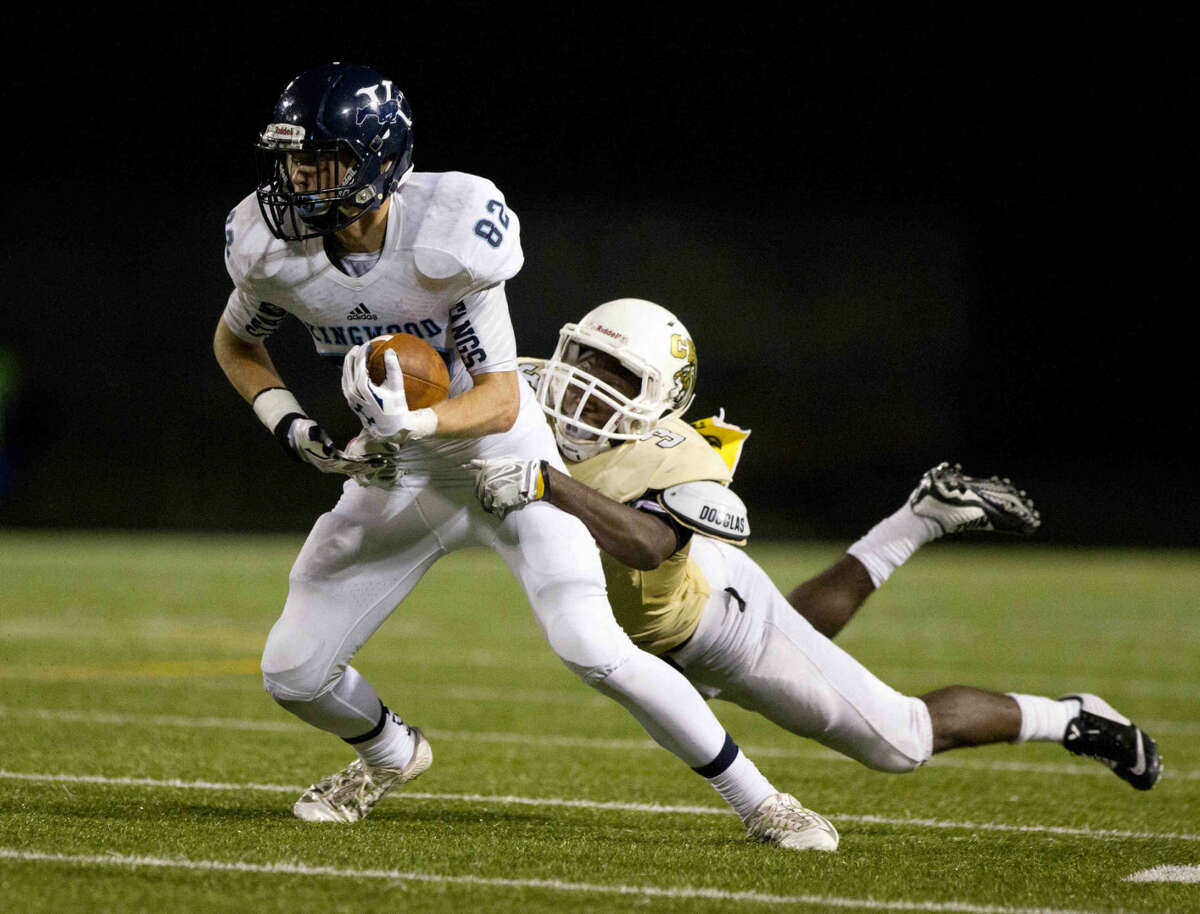 Kingwood wide receiver Chase Evans break a tackle during a football game Friday. To view or purchase this photo and others like it, visit HCNpics.com.