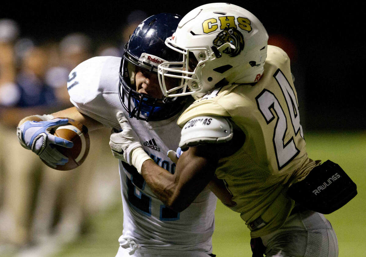 Kingwood running back Griffin Lay gets past Conroe defensive back Jerold Evans for a touchdown during a football game Friday. To view or purchase this photo and others like it, visit HCNpics.com.
