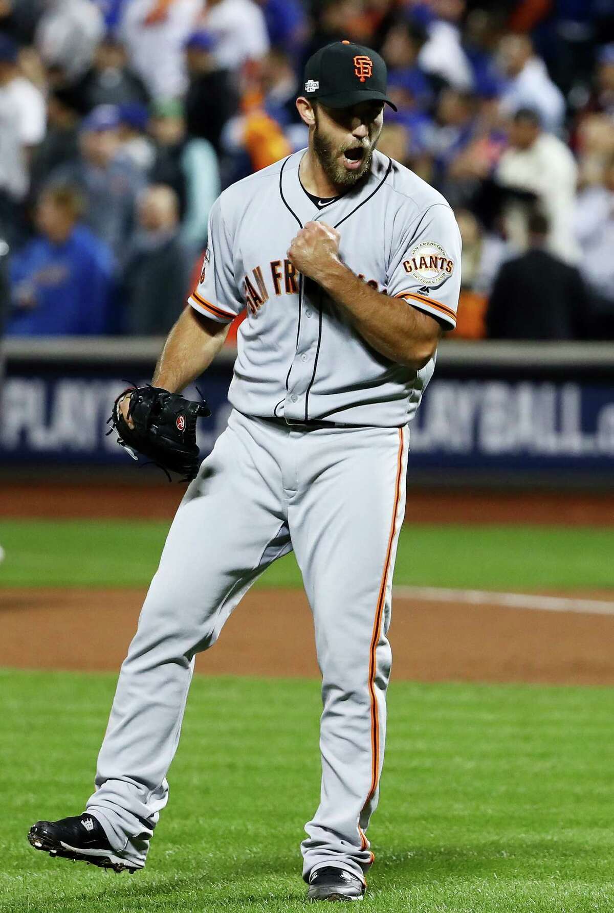 The Giants' heroes were unlikely and expected as No. 8 hitter Conor Gillaspie, left, smacked a three-run homer in the ninth inning to back the shutout pitching of postseason stalwart Madison Bumgarner.