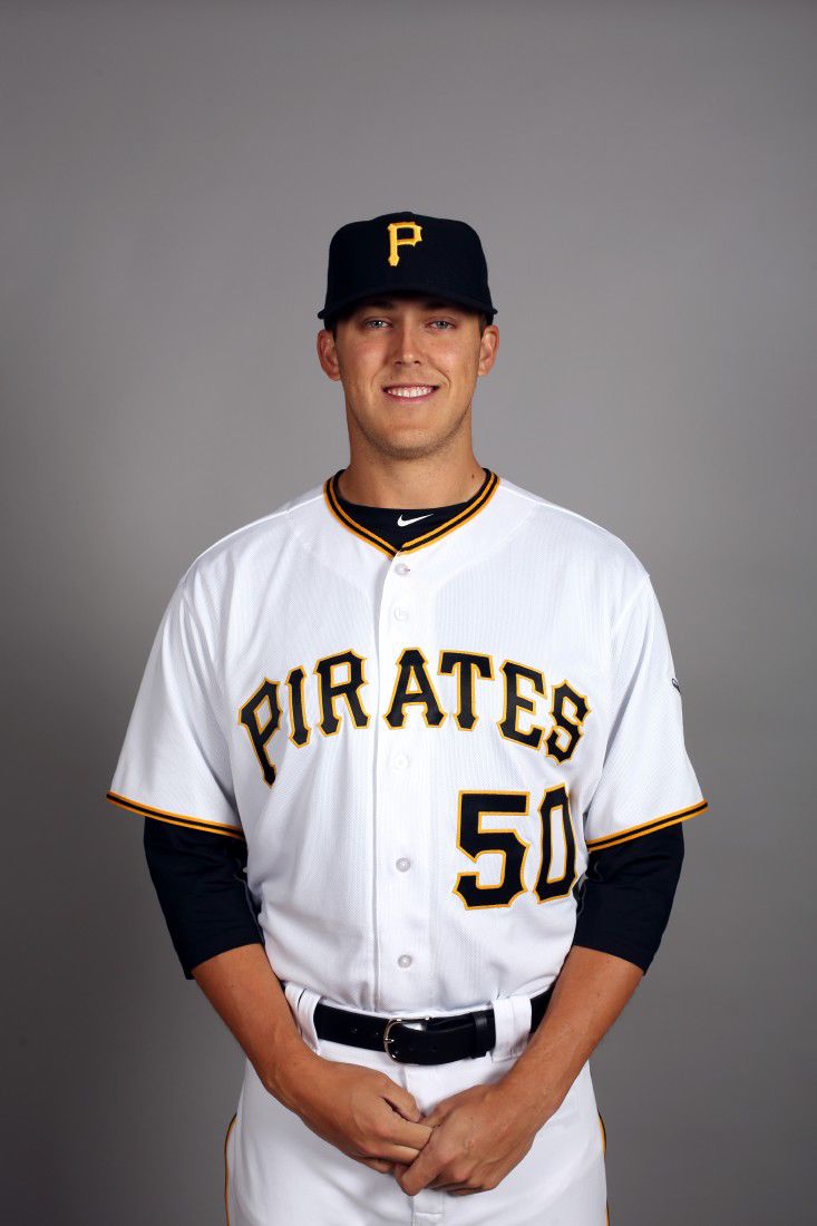 The Woodlands' Jameson Taillon pitches during a night game April