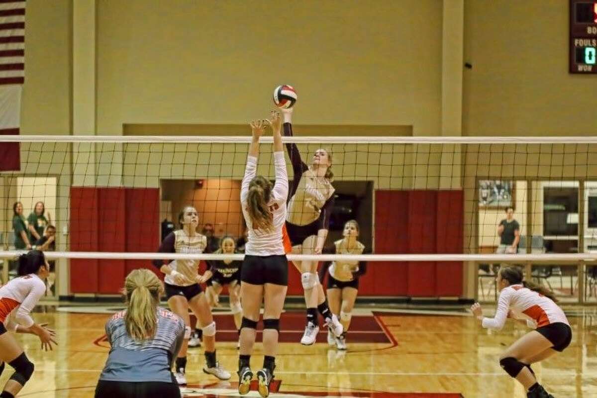 Tarkington LadyHorn Claire Chapman (13) has been named to the 2015 TGCA All-State Team and the All-Stars Team. Shown here, Chapman attacks the net in their game against Organefield Nov. 2, 2015, Tarkington won 3-0.