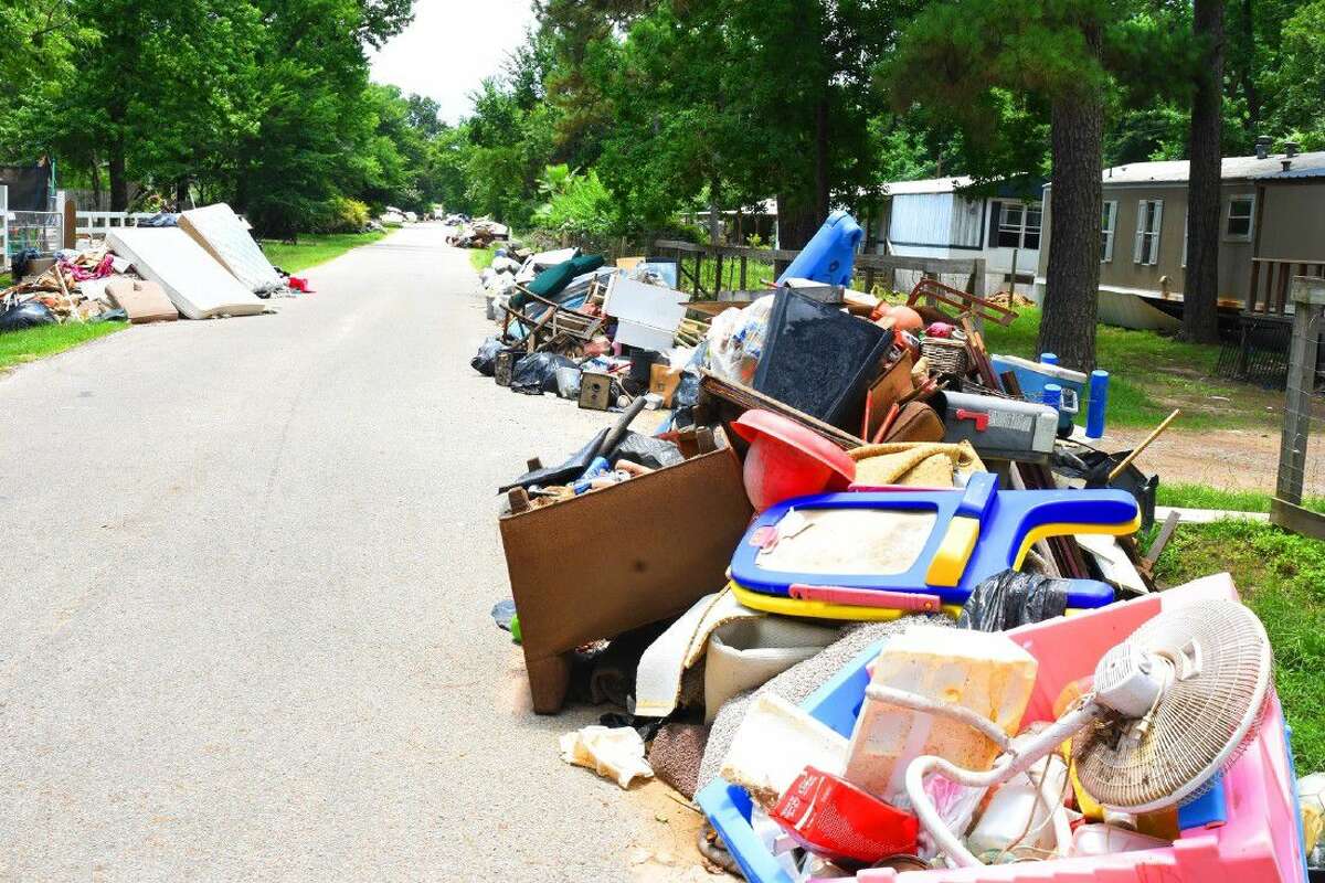 Residents along Valle Street and Foxwood off of state Highway 249 along Spring Creek continue to clean up this week following the devastating floods on Memorial Day weekend.