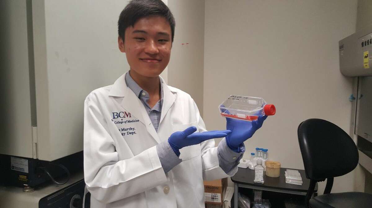 Jason Zhang holds a culture of cells he is growing to help determine the specific gene causing a congenital disorder in newborns Thursday, June 23, 2016, at the Baylor College of Medicine.