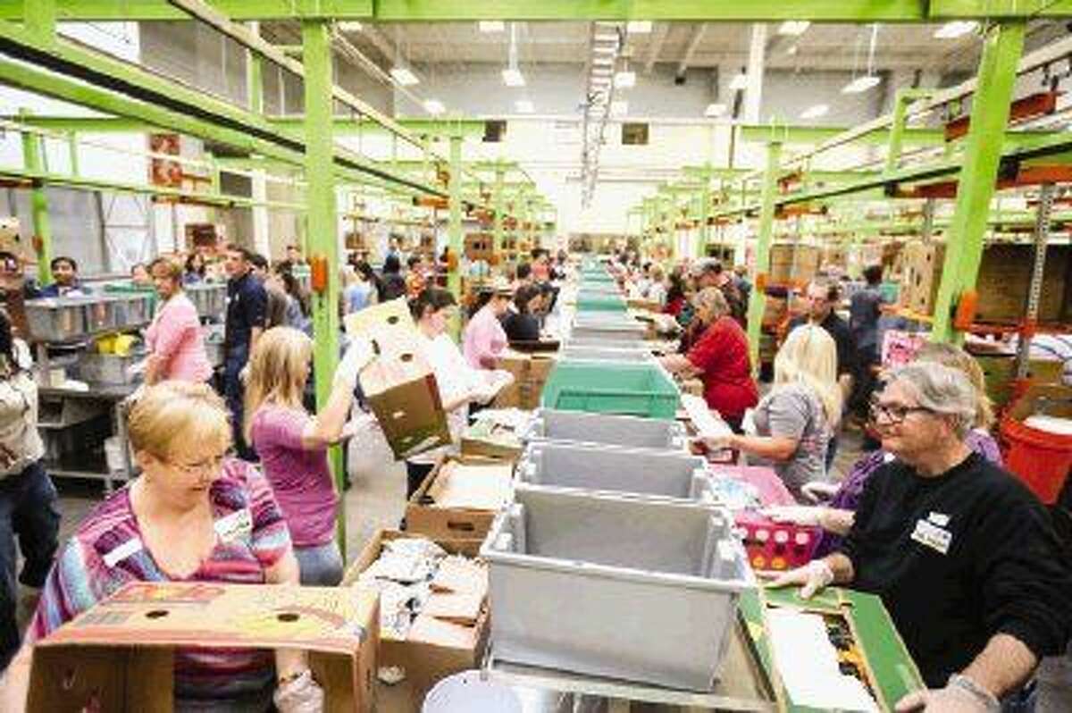 HCN Brings The Team Together While Volunteering At The Houston Food Bank