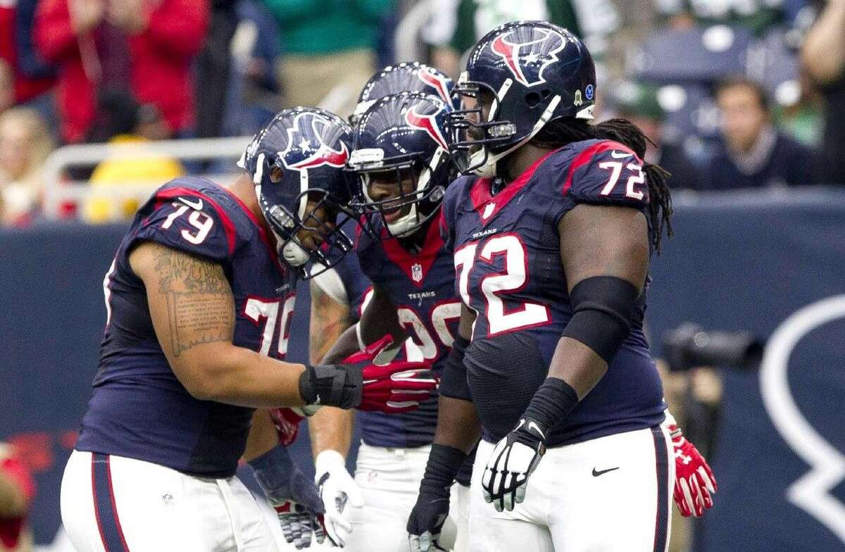 Houston Texans running back Alfred Blue, center, celebrates with teammates after catching a 21-yard touchdown pass from Cecil Shorts last Sunday against the New York Jets.