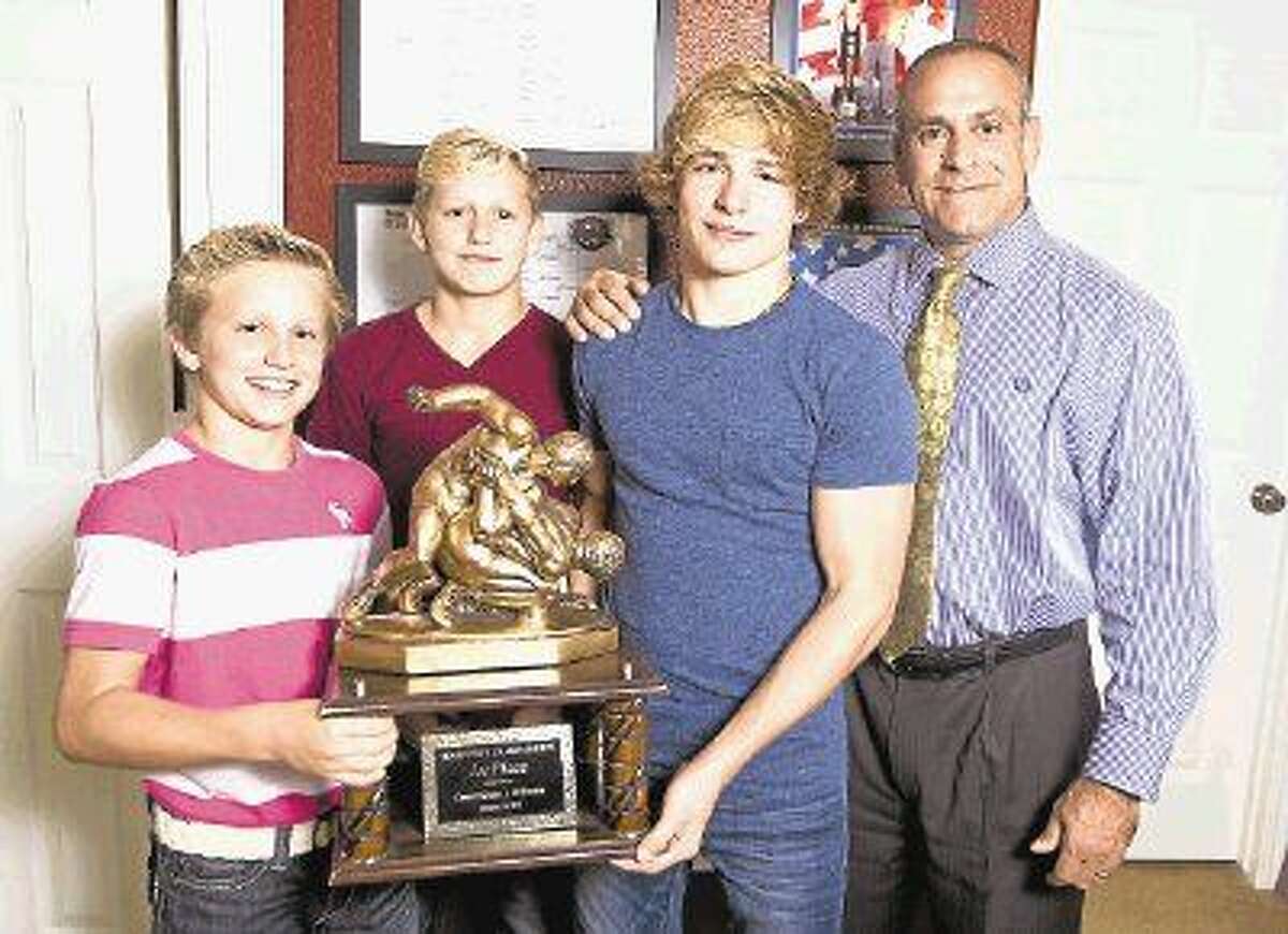 In addition to starting the Highlander Youth Wrestling Club, leading the team to a state championship and 35 individual state titles, Brett Gerard has helped coach his three sons to a combined nine state titles on the mat.