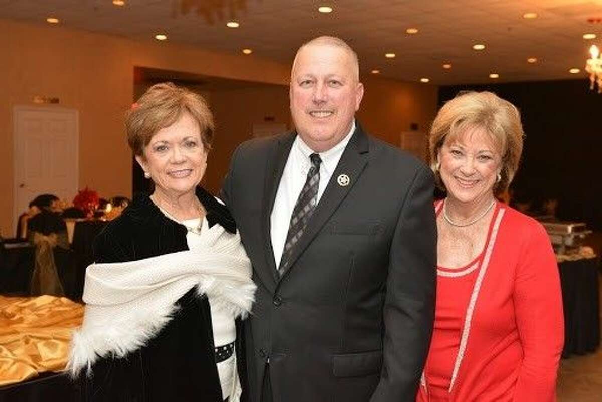 Constable Mark Herman with Texas Repertory Theatre Guild Co-Presidents Gina Wolford and Susan Cofran.
