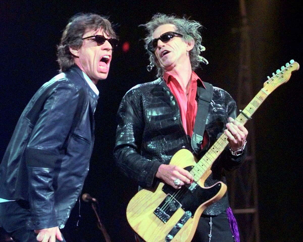 FILE - In this Monday, March 22, 1999, file photo, Mick Jagger, left, and Keith Richards perform "Jumping Jack Flash" during the Rolling Stones' No Security Tour performance at the Fleet Center in Boston. It's back to the blues for the Rolling Stones. The band that first made its name covering songs by American blues artists Thursday Oct. 6, 2016 announced plans to release a blues album in December. The "Blue & Lonesome" album will be their first studio release in more than a decade. (AP Photo/Elise Amendola, File) ORG XMIT: LON112