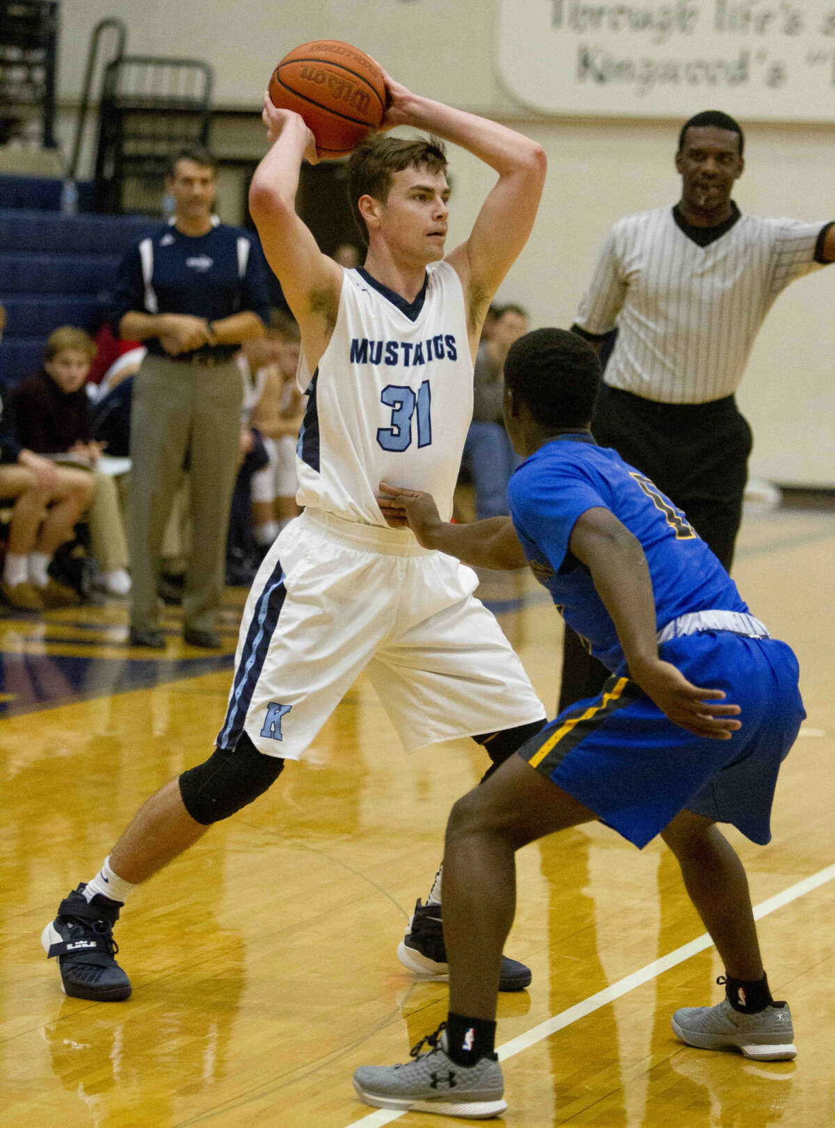 Kingwood guard Mitchell Clouse looks to pass during a basketball game at the Insperity Holiday Classic at Kingwood High School Monday, Dec. 28, 2015. Go to HCNpics.com to purchase this image and view more photos from the tournament.