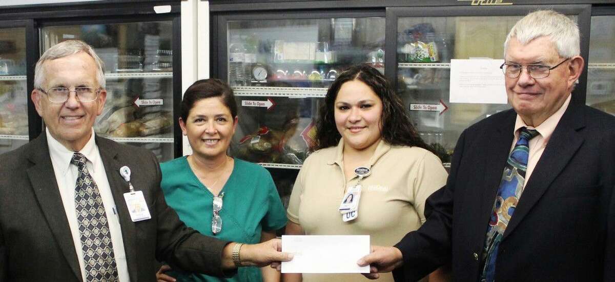 Chaplain Eddie Simmons along with Selma Atatural and Cindy Salgado from Memorial Hermann Southeast Hospital, deliver donations to Daer Platt, director of operations, Southeast Area Ministries (SeAM)From L to R: Eddie Simmons, chaplain, Memorial Hermann Southeast Hospital, Selma Atatural, lead office assistant, Memorial Hermann Southeast Hospital, Cindy Salgado, unit coordinator, Memorial Hermann Southeast Hospital and Daer Platt, director of operations, Southeast Area Ministries
