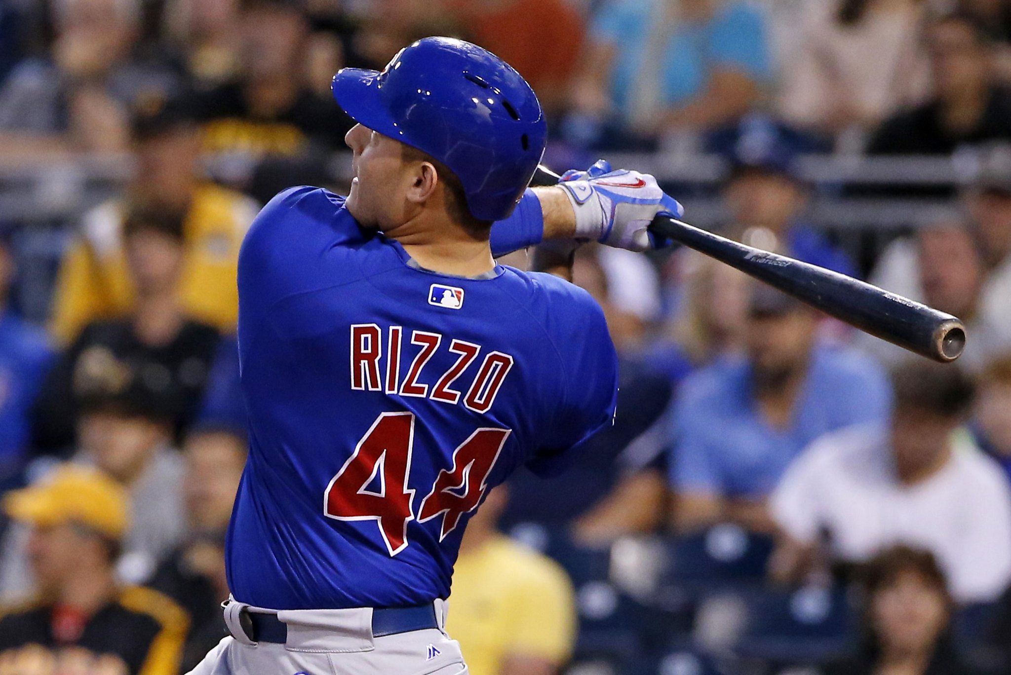 Chicago Cubs shortstop JAVIER BAEZ points to the crowd after hitting a home  run