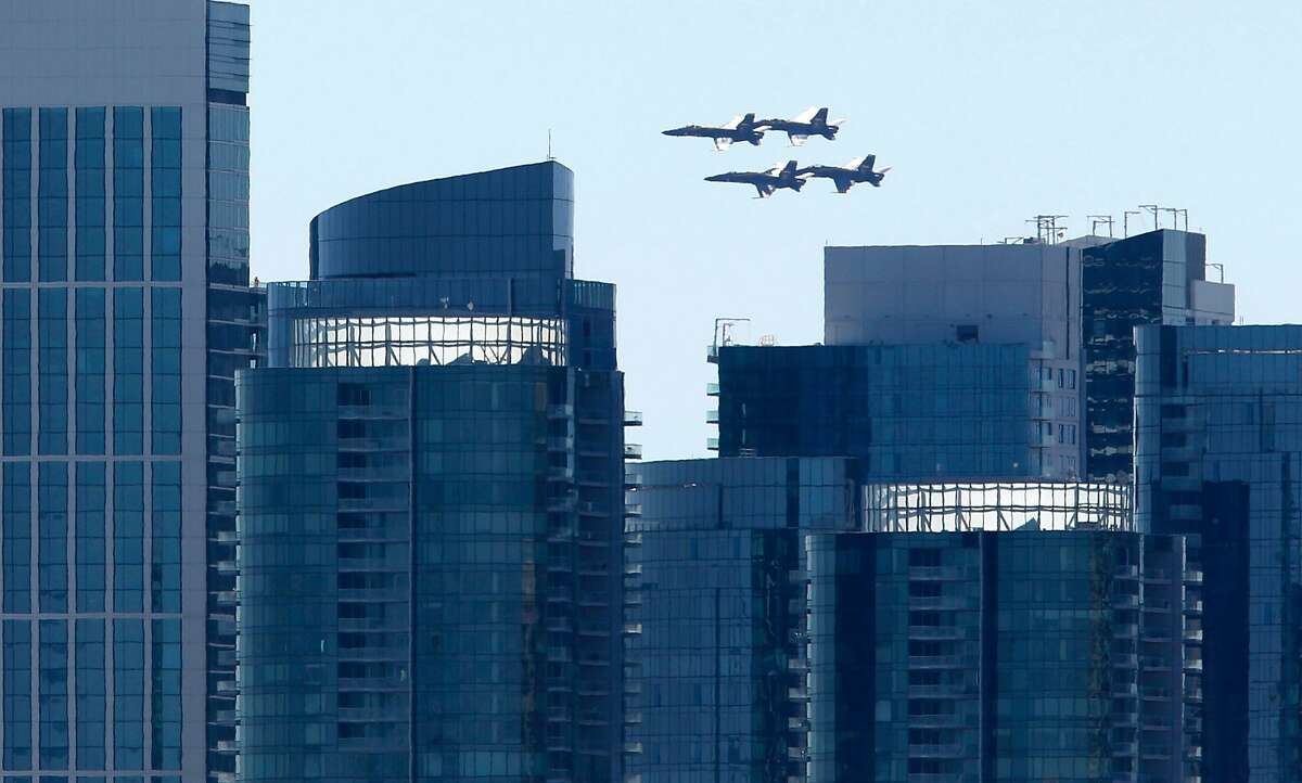 The Blue Angels fly past the glass towers near Rincon Hill during practice flight for this weekend's Fleet Week air shows in San Francisco, Calif. on Thursday, Oct. 6, 2016.