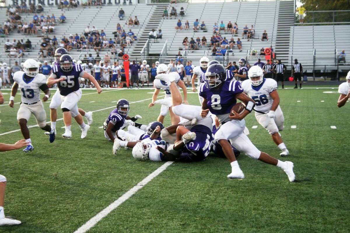 Senior Bronco Kendrec Gaines sweeps around the left side in the Broncos win over Clear Springs in a scrimmage game. Gaines is expected to play a big part in the offense this fall.
