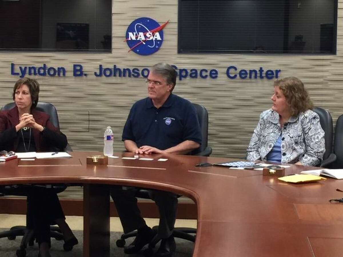 U.S. Rep. John Culberson, center, listens during a presentation Tuesday at Johnson Space Center in Houston.