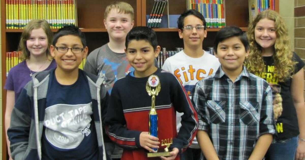 The Grangerland Intermediate Regional Destination Imagination First Place Structural Team poses for a picture. From left to right are Lela Lemke, Lindon Kelley, Bryce McCord, Heaven Johnson, Michael Gustavus, Edgar Ochoa and Sebastian Tejeda.