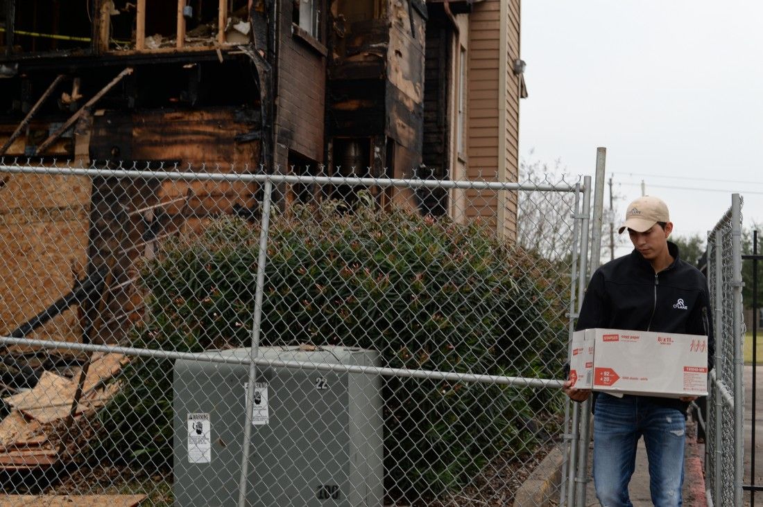 Worker helps rescue resident from fire