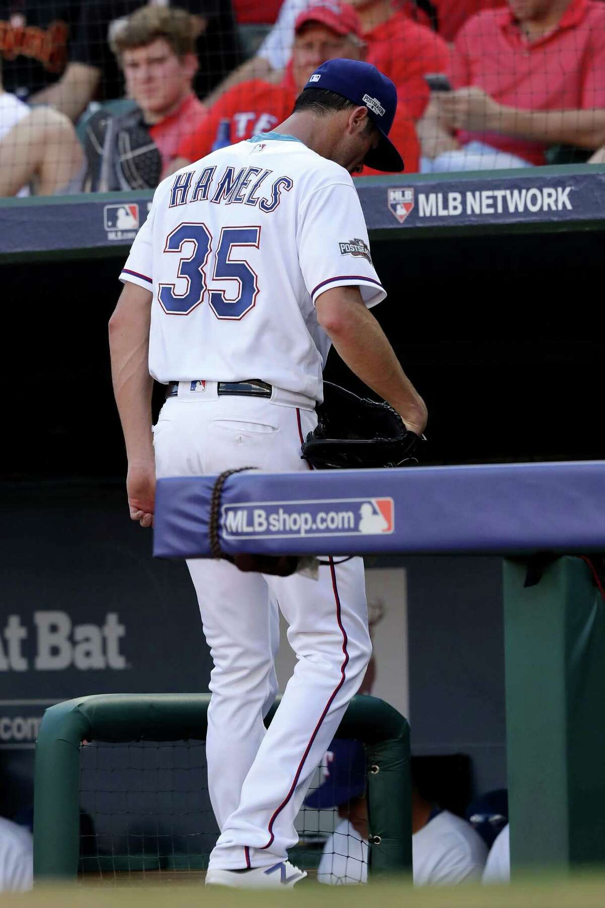 ARLINGTON, TX - OCTOBER 06: Cole Hamels #35 of the Texas Rangers walks back to the dugout after being relieved during the fourth inning in game one of the American League Divison Series against the Toronto Blue Jays at Globe Life Park in Arlington on October 6, 2016 in Arlington, Texas. (Photo by Ronald Martinez/Getty Images)