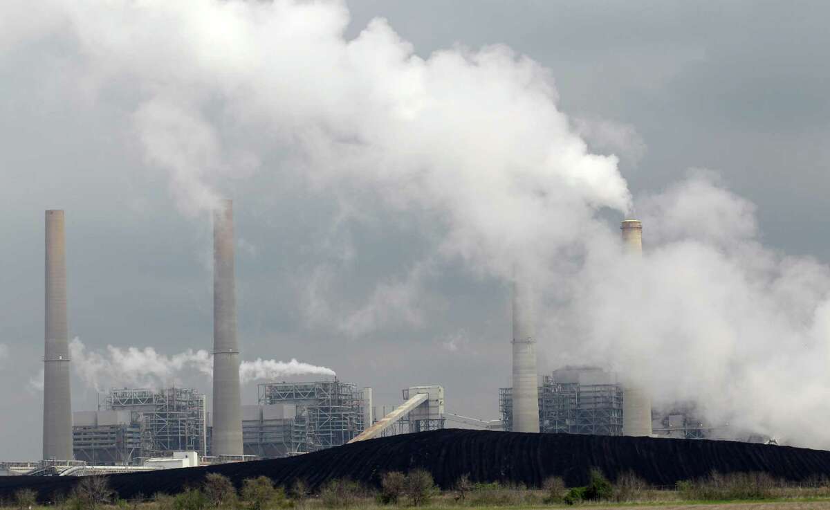 Exhaust rises from smokestacks at NRG Energy's W.A. Parish Electric Generating Station in Thompsons in 2011. As with most things in energy, politics are intertwined with the Clean Power Act..