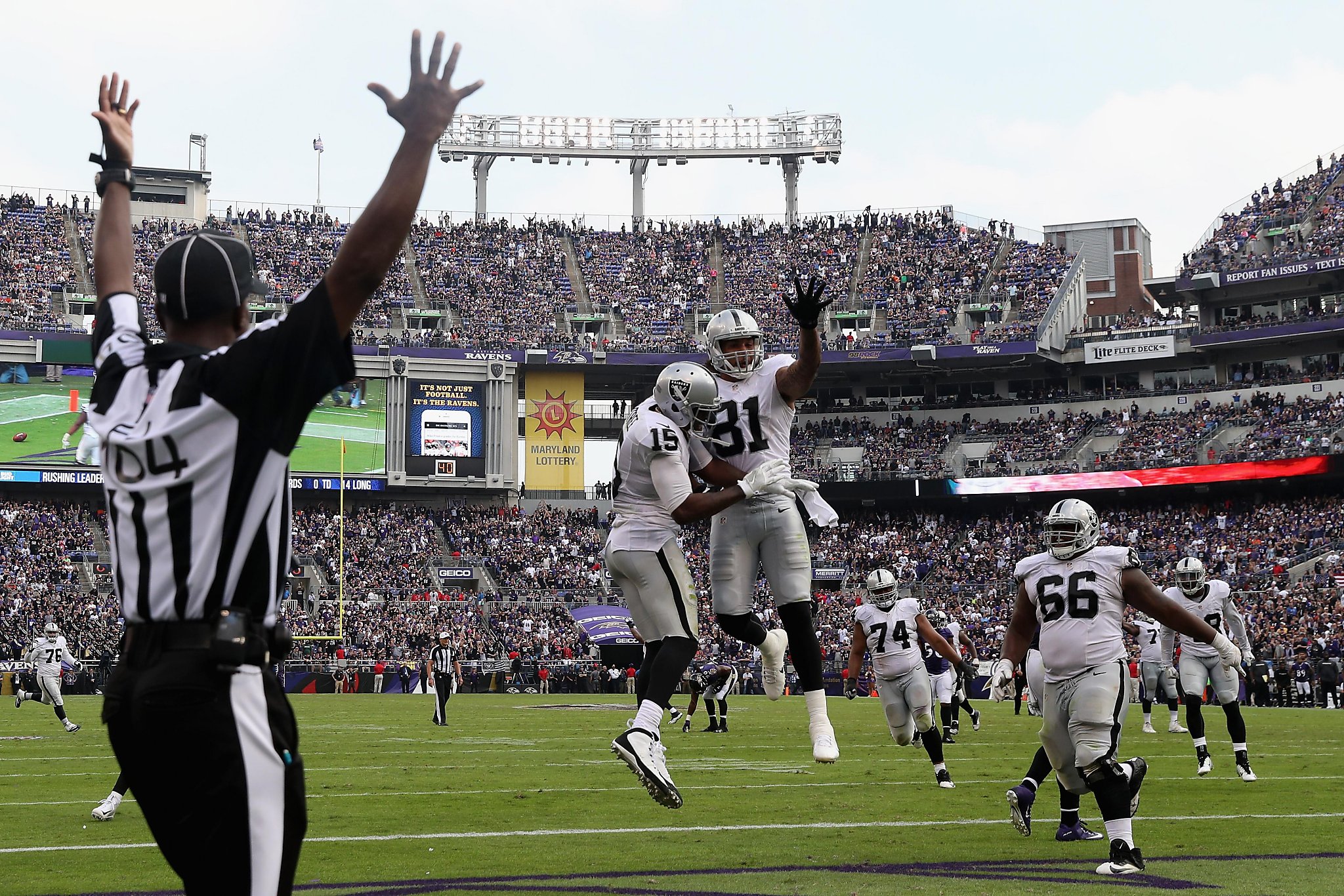 Oakland Raiders Michael Crabtree (15) celebrates with QB Derek