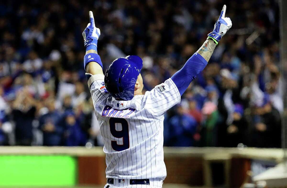 CHICAGO, ILLINOIS - OCTOBER 07: Javier Baez #9 of the Chicago Cubs celebrates after hitting a home run in the eighth inning against the San Francisco Giants at Wrigley Field on October 7, 2016 in Chicago, Illinois.